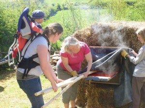 Baby Flynn gets in on the act as Jenny feeds poles into the steam box